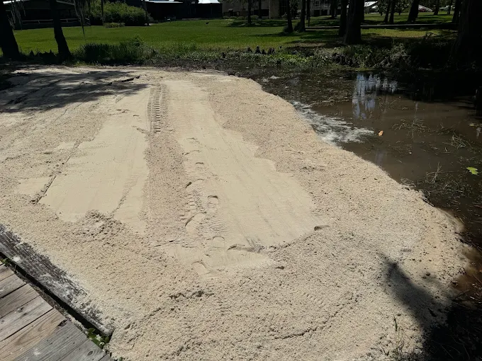 Fresh sand placed along a waterfront area by Archie Powell Inc.